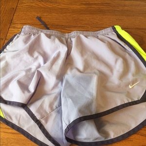 Purple and neon yellow Nike shorts. Kids